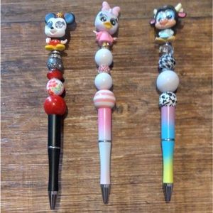 Doorables topped beaded pens.